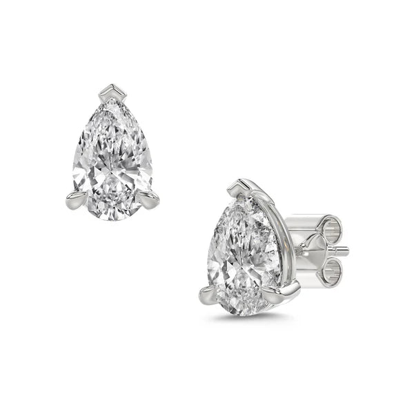 Pair of pear-shaped diamond earrings on a white background