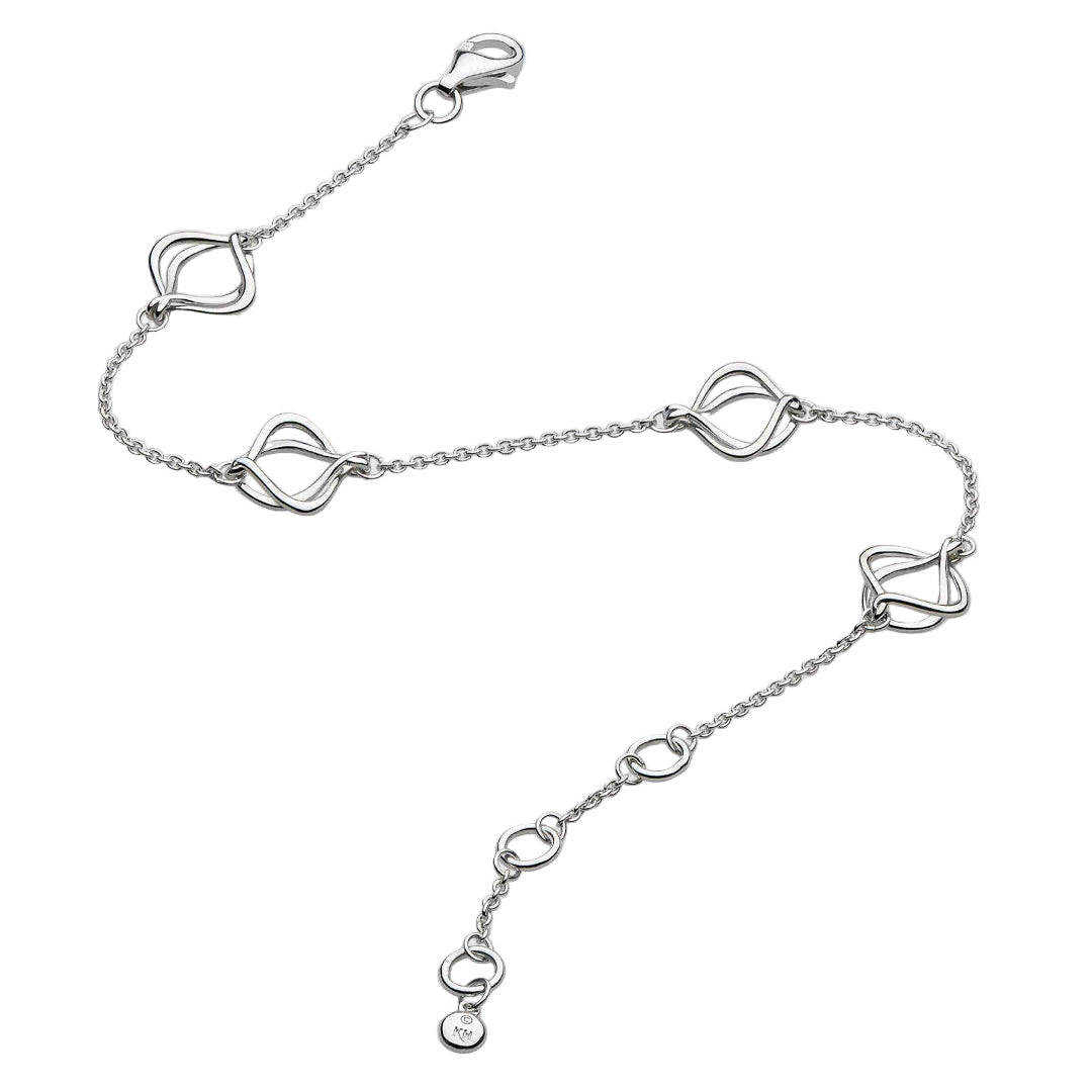 A silver chain anklet featuring four interlocking heart-shaped links and a lobster clasp, displayed on a light gray background.