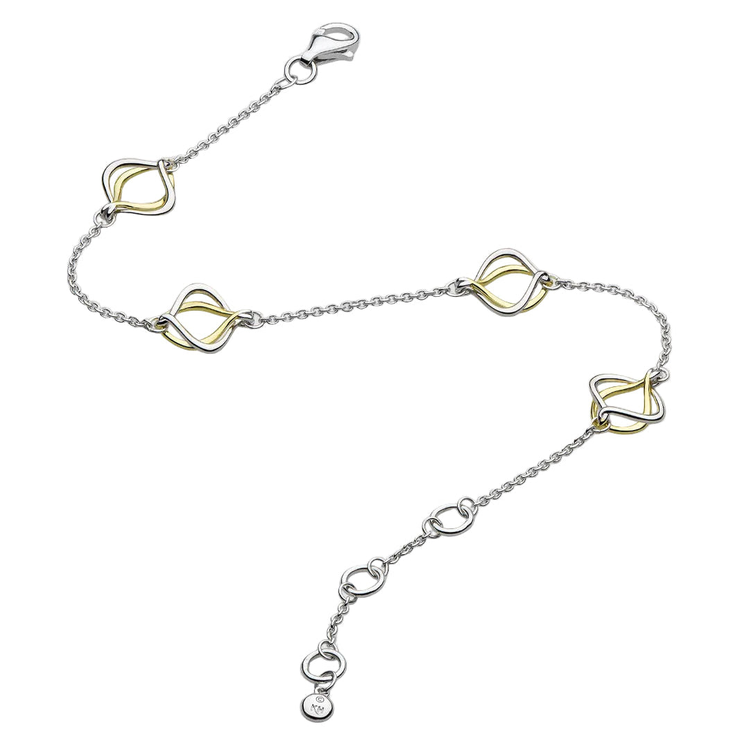 A silver chain anklet featuring five interlocking double-loop heart-shaped charms in a two-tone silver and yellow gold finish, displayed on a light gray background.