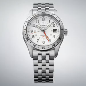 Silver Seiko watch with a white face on a light gray background