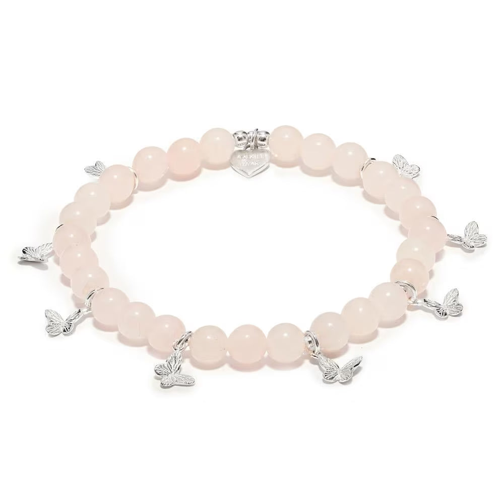 Pink beaded bracelet with silver butterfly charms on a white background