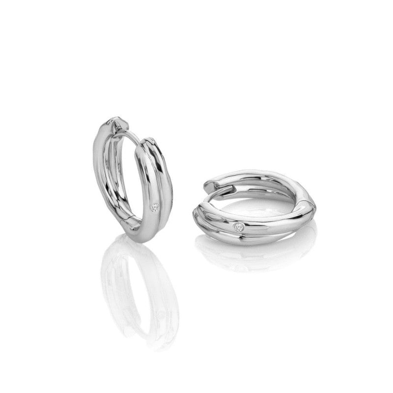 Pair of silver hoop earrings on a white background
